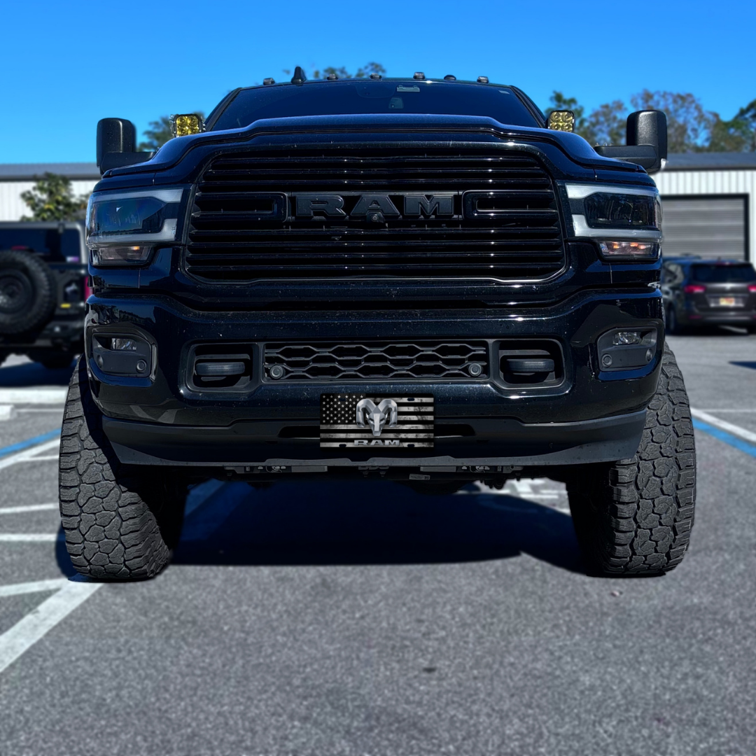 RAM – Distressed Flag front plate on a black Ram truck
