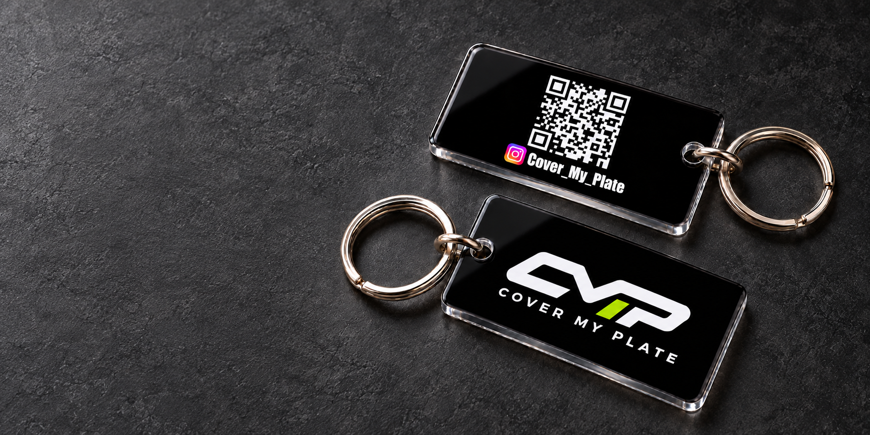 Black acrylic Cover My Plate keychains: logo on the front, Instagram QR code and handle on the back
