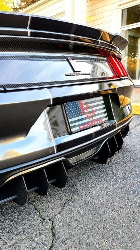Rear of a Mustang with a Coyote flag plate cover