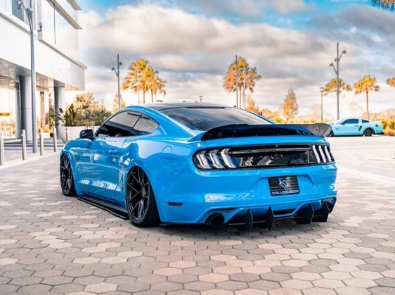 Blue Mustang with a Coyote flag plate cover