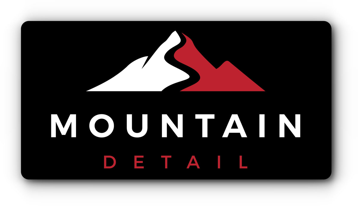 Custom plate cover with a mountain logo for a detailing business